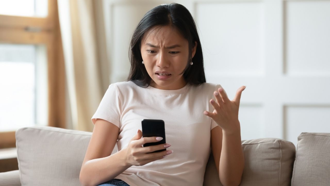 woman frustrated talking on phone