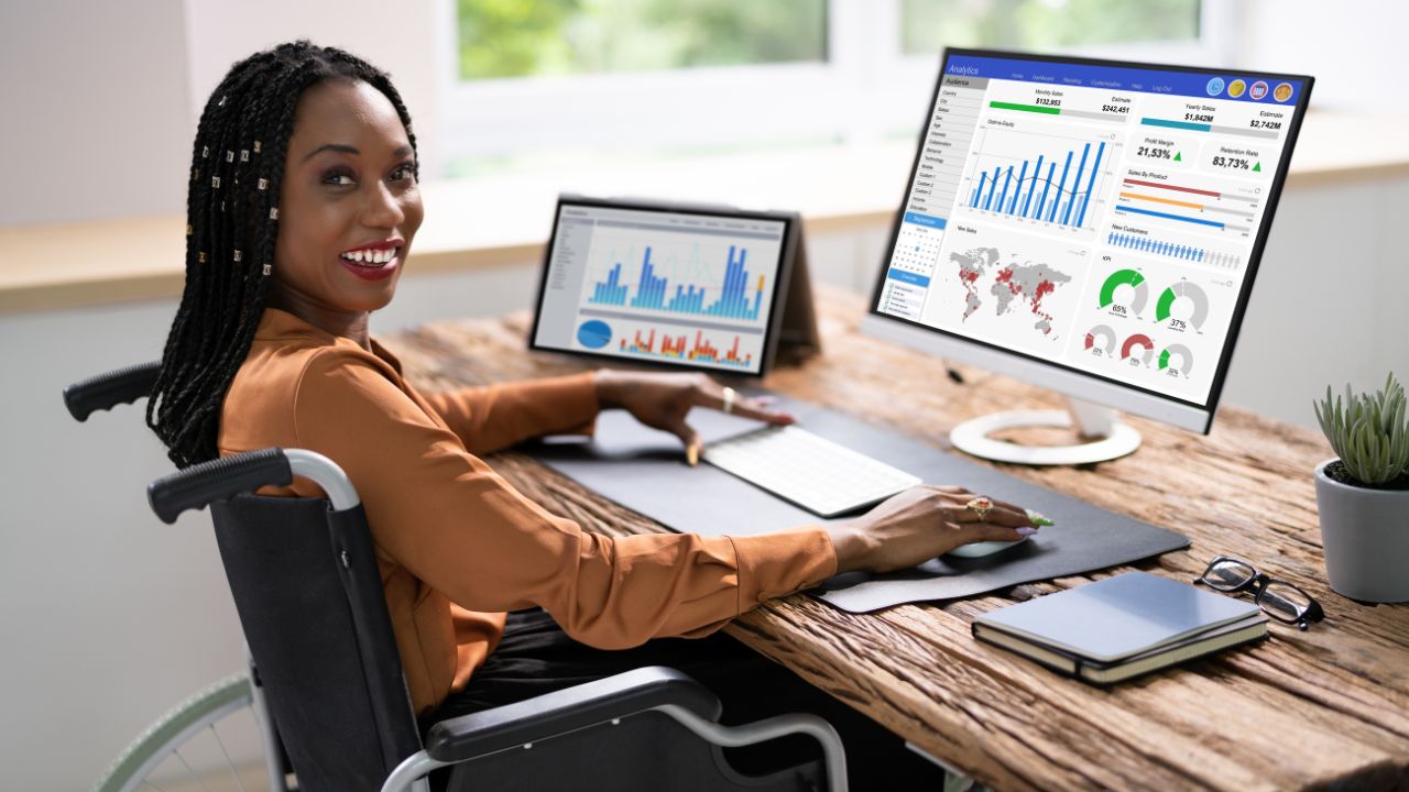 woman looking at data on computer